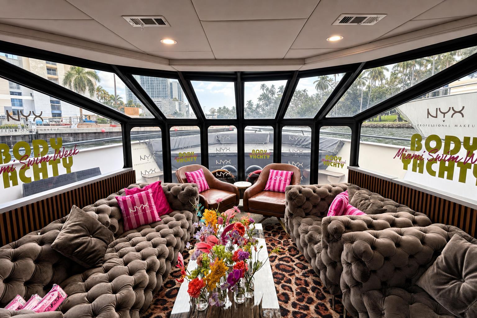 Upper-deck sky lounge with wraparound NYX Body Yachty perforated window vinyl on a Miami yacht